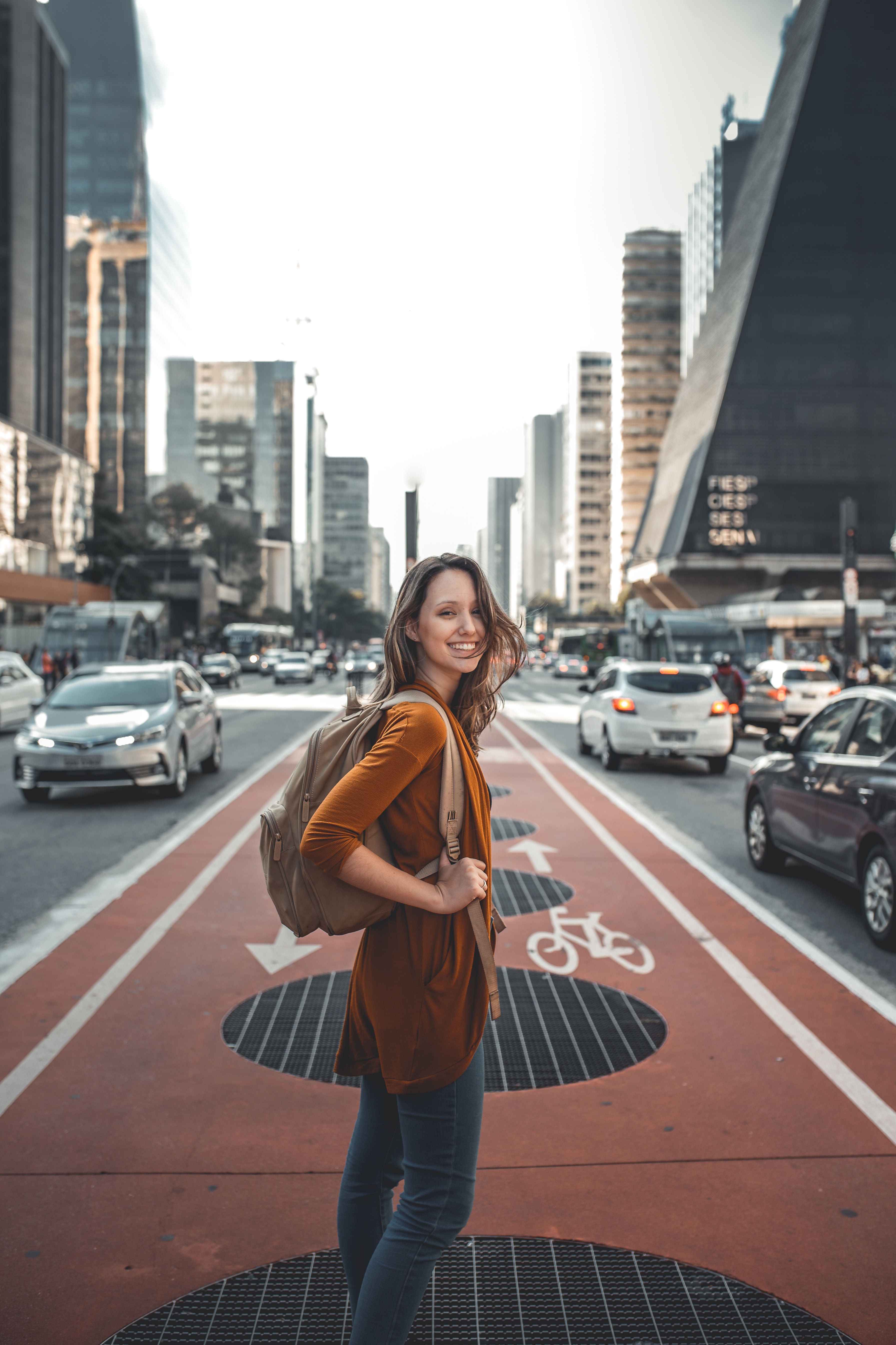 Image of a woman traveling a city